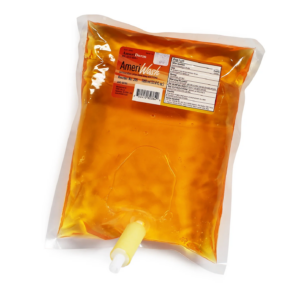 A sealed bag of orange liquid with a white spout at the bottom.