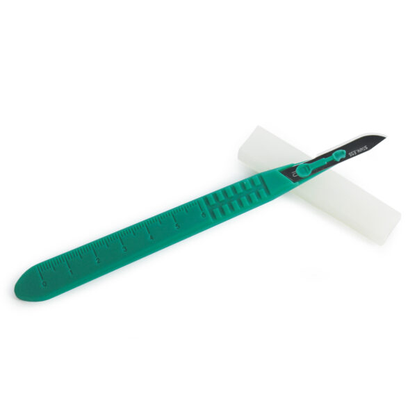 Green-handled surgical scalpel with a blade and protective cover.