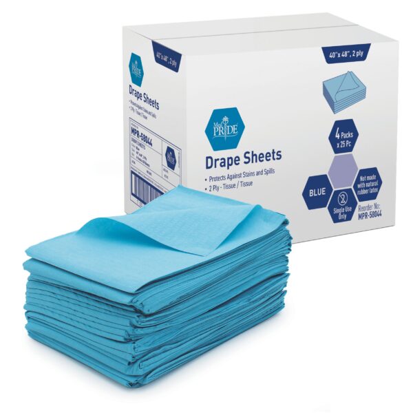 Stack of blue disposable drape sheets with packaging box in background.