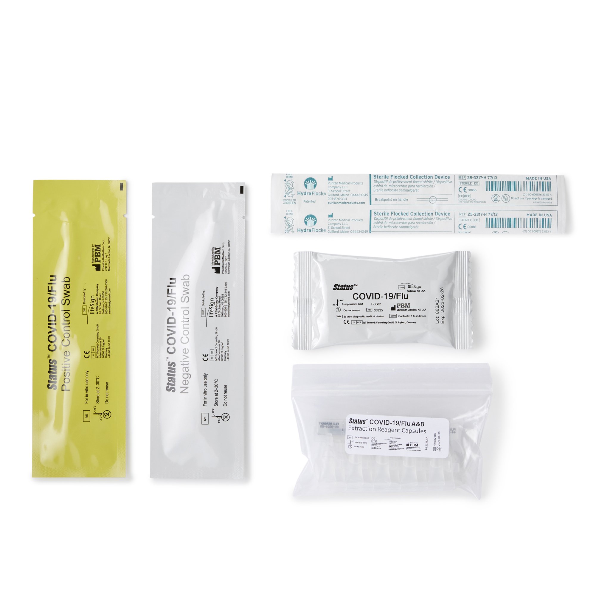 Various medical swabs and testing kits laid out on white background.