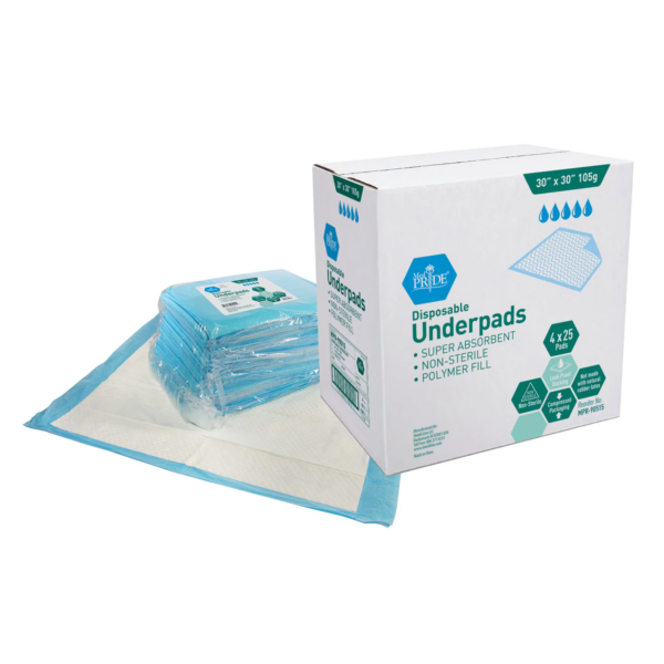 Disposable underpads in a stack next to their packaging box.